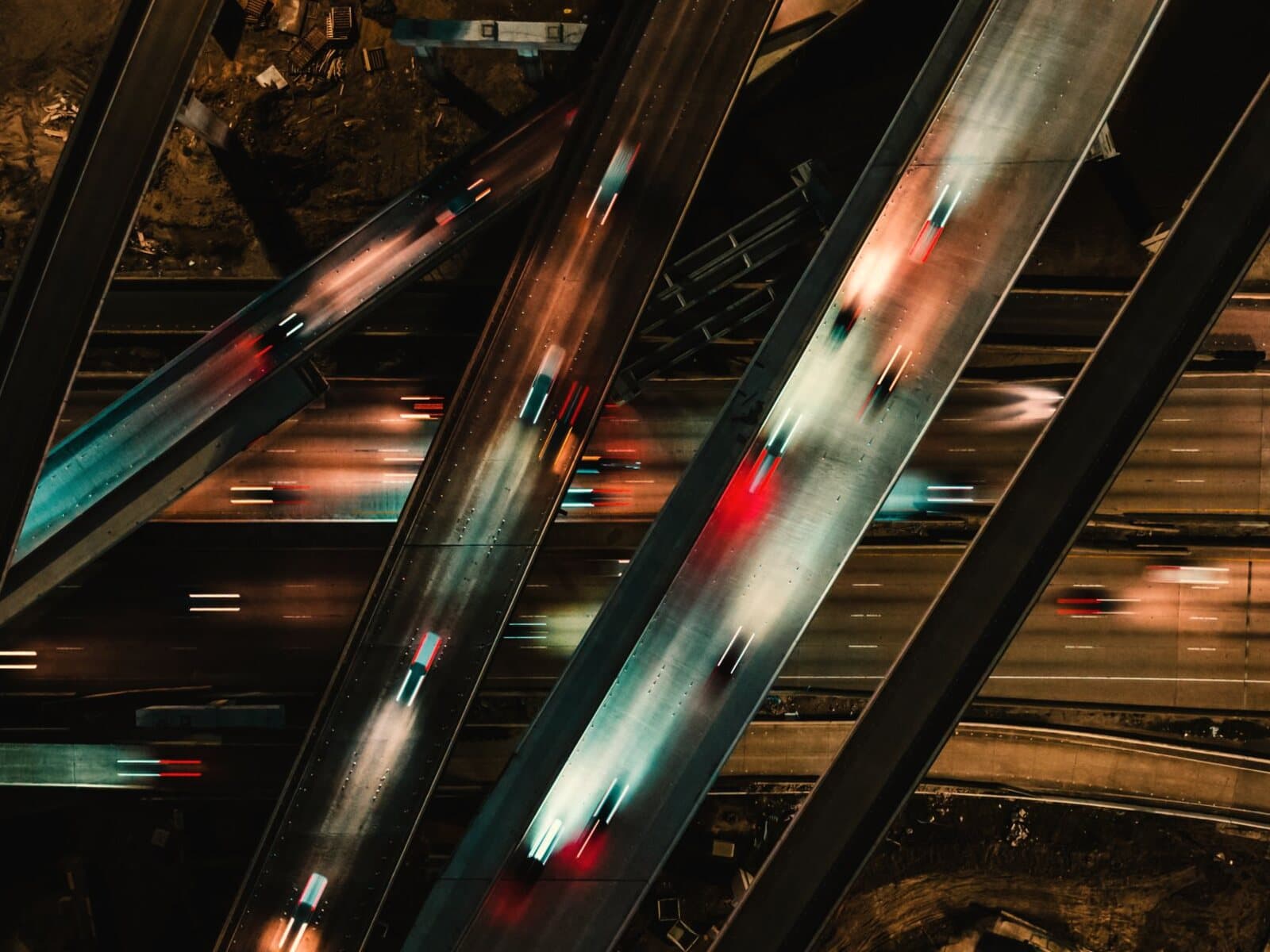 Houston freeways at night from above, with traffic streaming in both directions